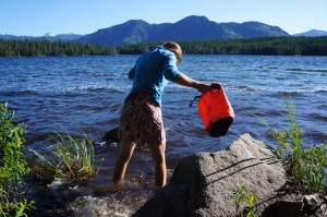 Gathering washing water at another wild camp.